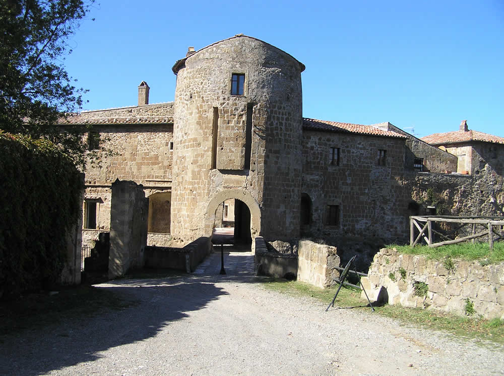 The round tower in which traces of the disappeared drawbridge are still visible. Rocca degli Orsini, Sorano, Grosseto. Author and Copyright Marco Ramerini